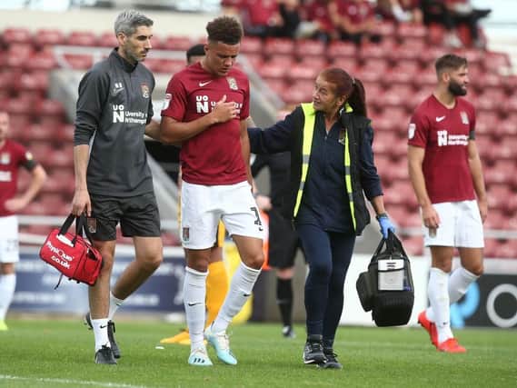 Shaun McWilliams leaves the field with chest problems. Picture: Pete Norton