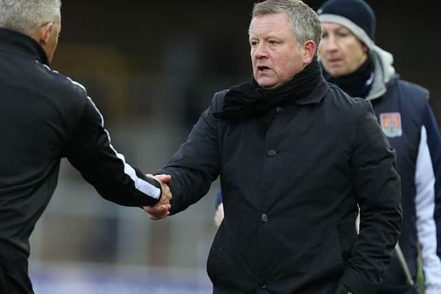 Then-Carlisle manager Keith Curle shakes hands with Chris Wilder after Cobblers' victory at Brunton Park in 2016.
