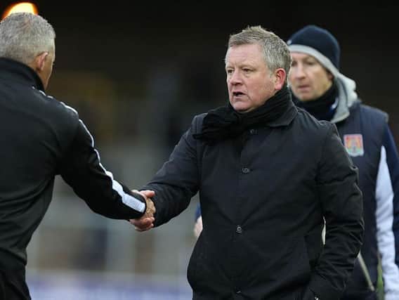 Then-Carlisle manager Keith Curle shakes hands with Chris Wilder after Cobblers' victory at Brunton Park in 2016.