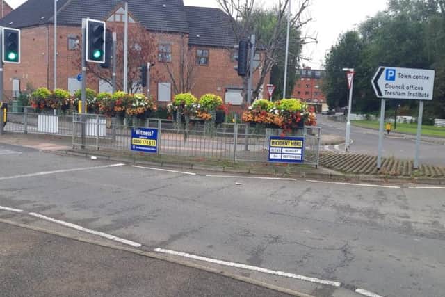 Signs appealing for witnesses are at the scene.