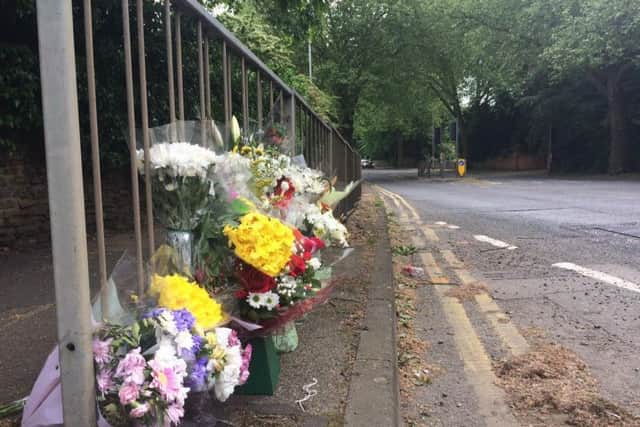 Flowers were left where Stephen Swann was killed in a hit-and-run crash on Wellingborough Road last year