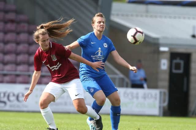 Cobblers' Georgia Tear battles with Peterborough's Stacey McConville