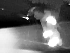 The thief can be seen peering into a car on Pearmain Court, Northampton
