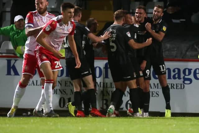 Harry Smith celebrates after scoring for the Cobblers (Pictures: Pete Norton)