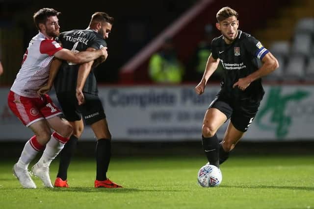 Charlie Goode takes the ball out of defence