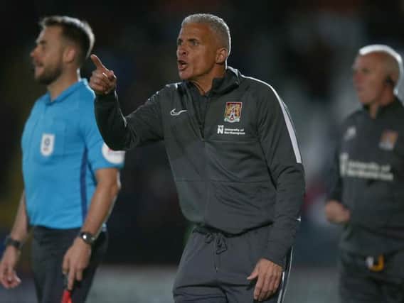 Keith Curle gets his point across during the Cobblers' 1-0 win at Stevenage (Picture: Pete Norton)