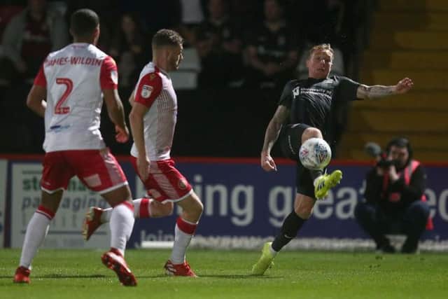 Nicky Adams stretches for the ball. Pictures: Pete Norton