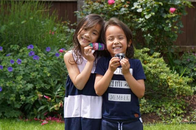 Myles Talbot and his sister Melitta, seven, with their rocks for the game. Photo: MowMow Rocks