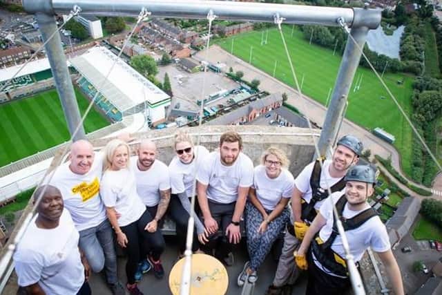 The David Wilson Homes representatives at the top of the tower after completing the abseil