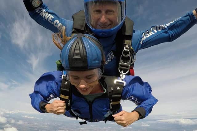 Lizzy Clarke falling through the air for Brain Tumour Research in honour of her friend Matthew Marchant