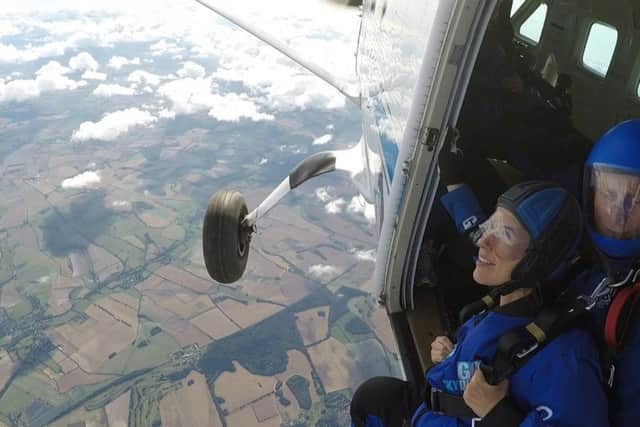 Don't look down! Lizzy Clarke braces herself for the skydive for Brain Tumour Research