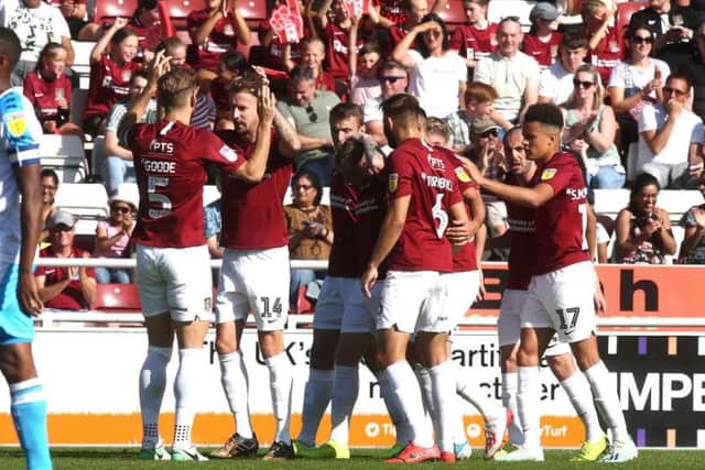 The Cobblers players celebrate after Chris Lines had put them 1-0 up with a first-half penalty (Pictures: Pete Norton)