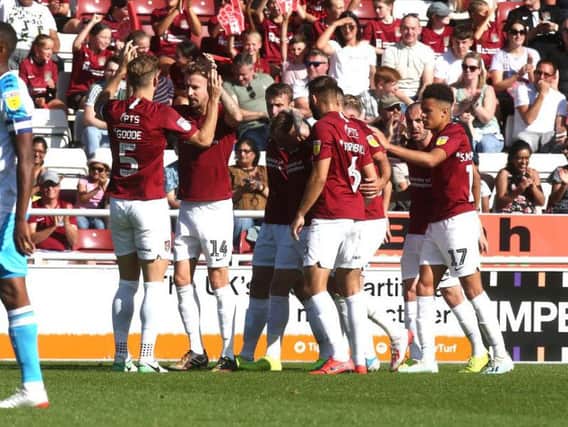 The Cobblers players celebrate after Chris Lines had put them 1-0 up with a first-half penalty (Pictures: Pete Norton)
