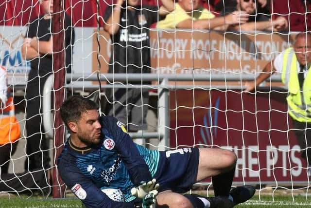 Crawley goalkeeper Glenn Morris saves Chris Lines' second half penalty