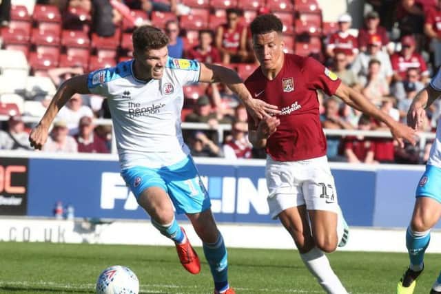 Shaun McWilliams battles for the ball