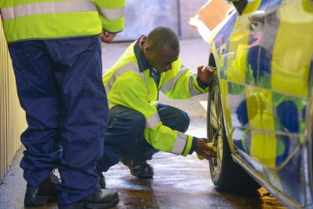 LIVE volunteers wash a car at Weston Favell Police Station. Photo: Northamptonshire Police