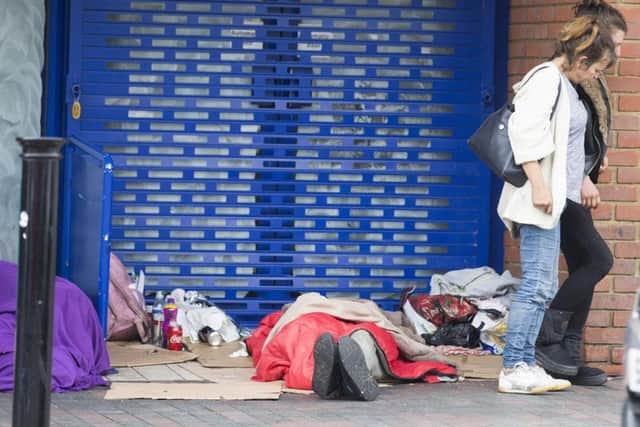 A rough sleeper beds down in Abington Street. Official figures have found that seven homeless people died in the town during 2017.