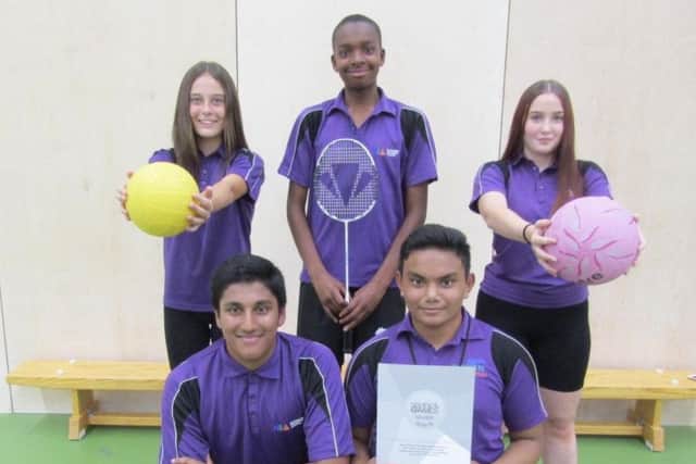 (L-R from back row) Northampton International Academy Year 10 pupils Sophie Buswell, Matthew Mdemu, Holly Goodacre, Yasir Abdul and Ibrahim Thanbir