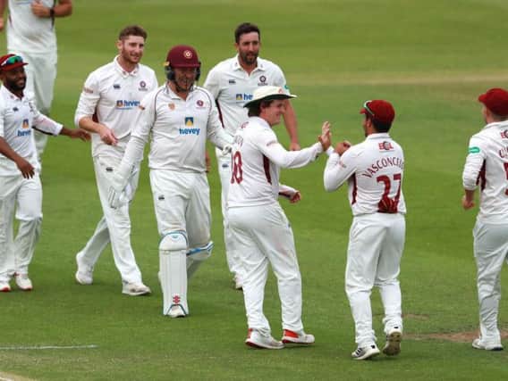 Northants celebrate claiming a wicket in the draw with Lancashire in July
