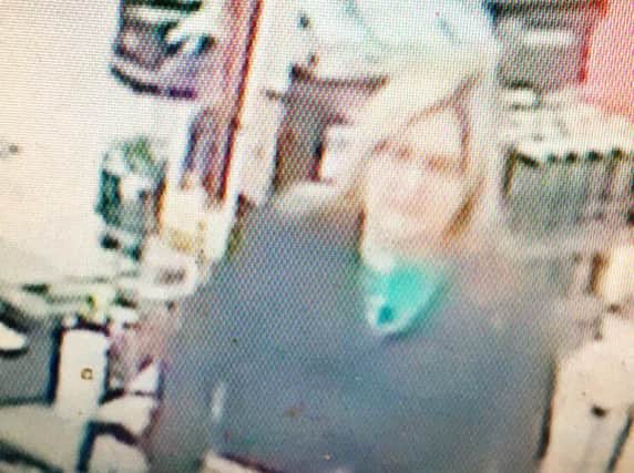 Police want to speak to this woman about the purse theft in B&M in Weston Favell. Photo: Northamptonshire Police