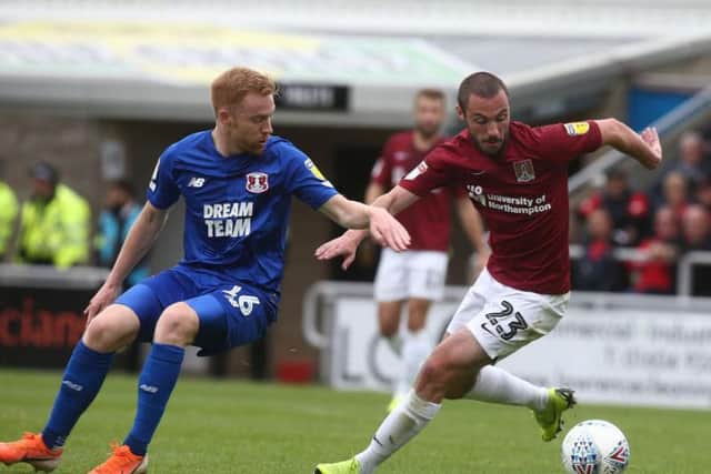Michael Harriman battles with Leyton Orient goalscorer James Brophy (Picture: Pete Norton)