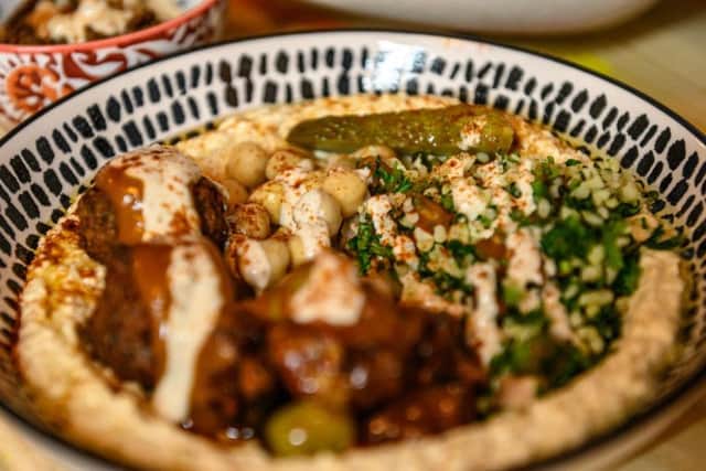 Favourites on its menu include filled pitas with hummus, falafel and salad as well as shakshuka made with aubergine and fava beans.