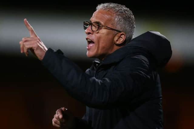 Keith Curle shouts instructions from the touchline during the Cobblers' 1-0 Leasing.com Trophy win at Cambridge United on Tuesday (Picture: Pete Norton)