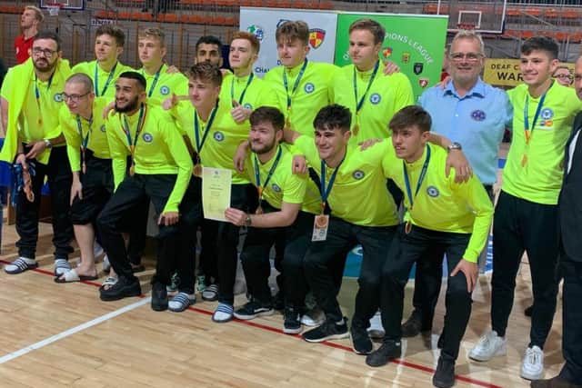 The Peterborough United deaf futsal team with their European Champions League medals