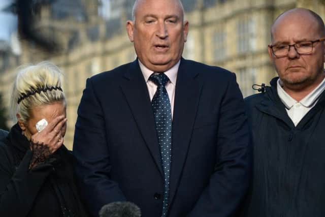Harry Dunn's parent's Tim Dunn (right) and Charlotte Charles with family spokesman Radd Seiger outside the Houses of Parliament after meeting Foreign Secretary Dominic Raab. Photo: Getty Images