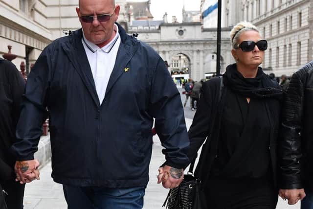 Harry's parents Tim Dunn and Charlotte Charles pictured yesterday in London after meeting Foreign Secretary Dominic Raab. Credit: Getty Images.