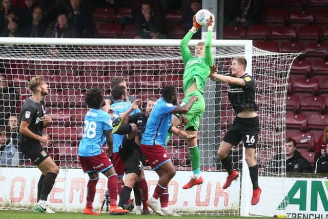Scunthorpe's substitute goalkeeper Jake Eastwood catches a cross. Picture: Pete Norton