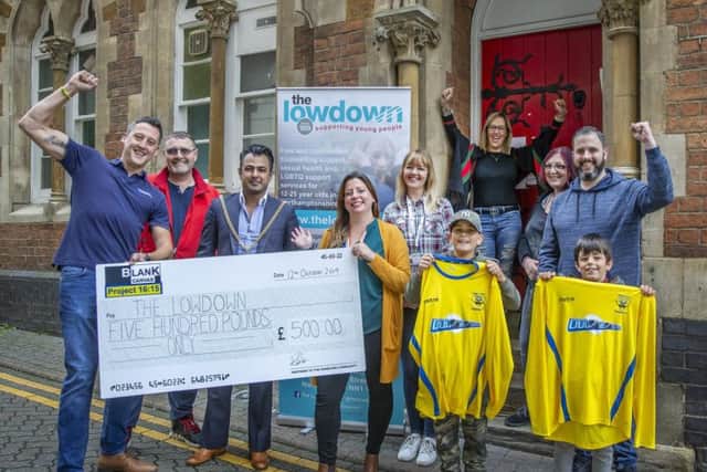 Stan Robertson, the mayor of Northampton, members of the Lowdown team and sponsors handed over the giant cheque in the town centre on Saturday.