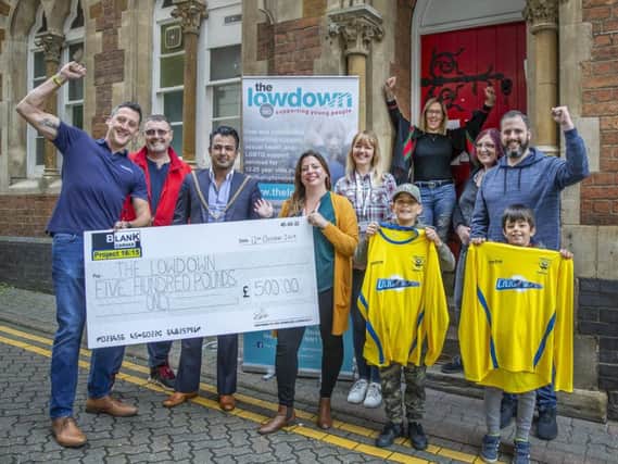 Stan Robertson, the mayor of Northampton, members of the Lowdown team and sponsors handed over the giant cheque in the town centre on Saturday.