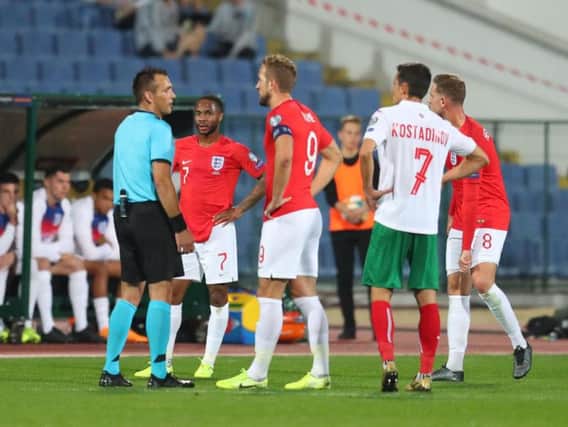 England captain Harry Kane speaks to the referee during one of the stoppages in Tuesday's game with Bulgaria. Picture: Getty.