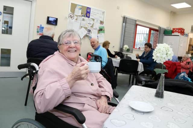 Margaret Mair enjoying a cup of tea.
