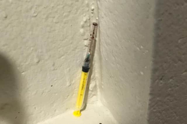 The blood-stained needle left in the hallway in Dover Court block of flats in Northampton for days