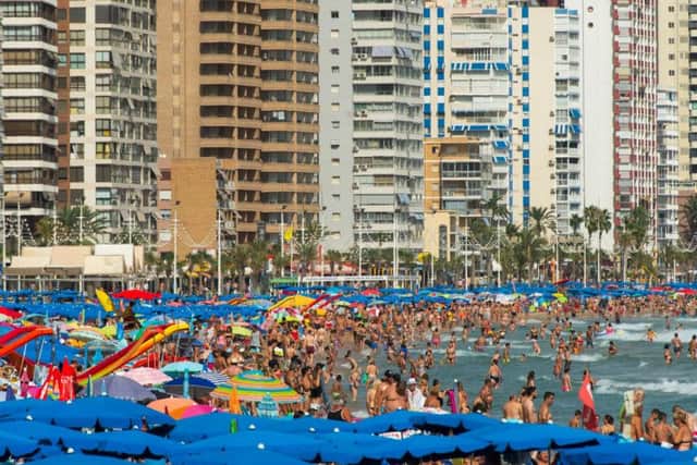 Sun-worshippers sunbathing at Levante Beach in Benidorm this year (file picture). Photo by David Ramos/Getty Images.