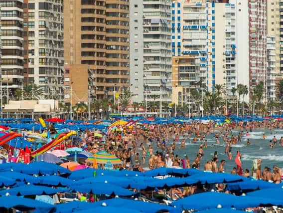 Sun-worshippers sunbathing at Levante Beach in Benidorm this year (file picture). Photo by David Ramos/Getty Images.