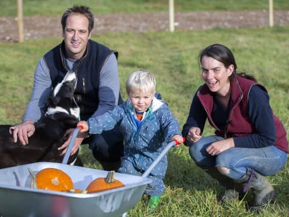 Tom, George and Lucy Harris pictured on their family farm in Moulton. Pictures by Kirsty Edmonds.