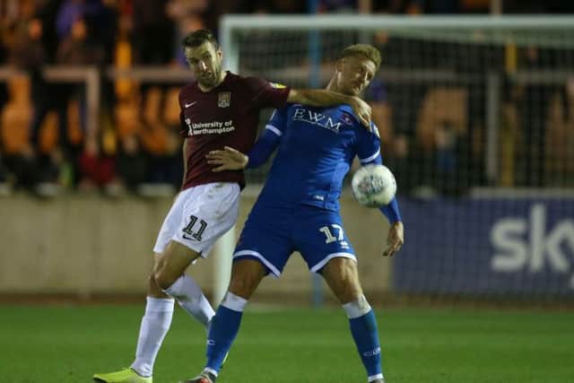 Andy Williams battles for possession