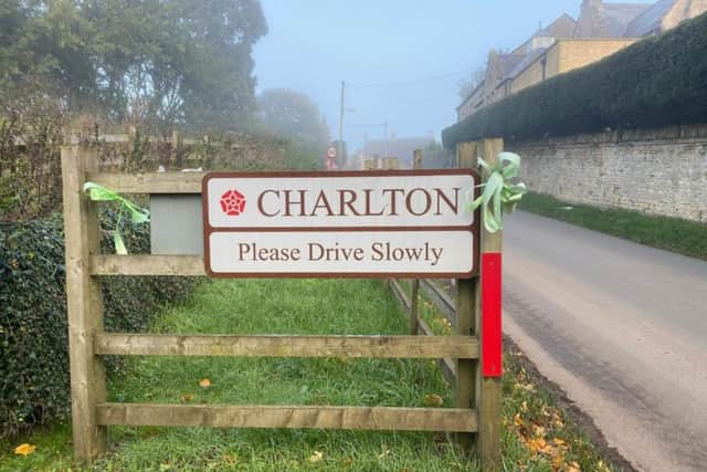 Green ribbons on the sign at the entrance to Charlton, where Harry lived