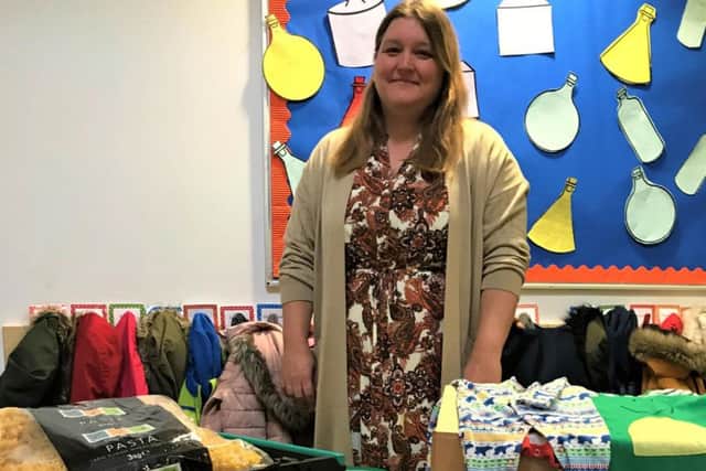 Castle Academy family support worker Louise Thomas with some of the food bank items being distributed to families this half term.