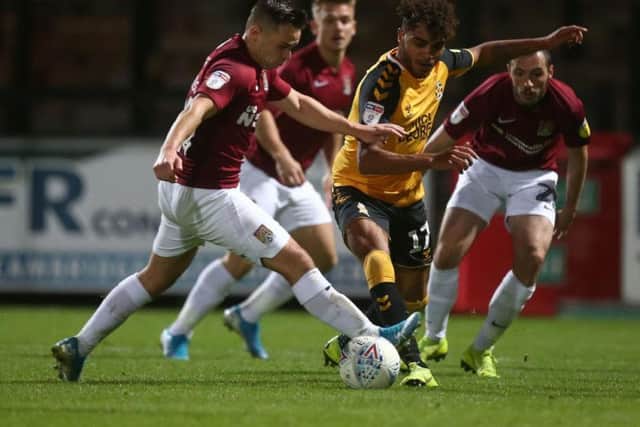 Leon Davies and Billy Waters in action when Cambridge hosted the Cobblers in the EFL Trophy earlier this month.