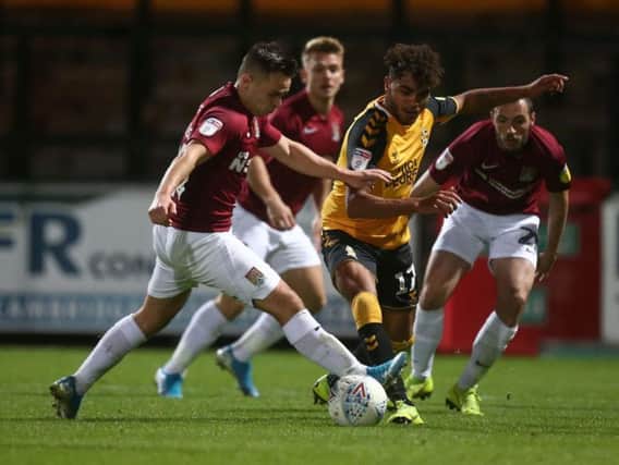 Leon Davies and Billy Waters in action when Cambridge hosted the Cobblers in the EFL Trophy earlier this month.