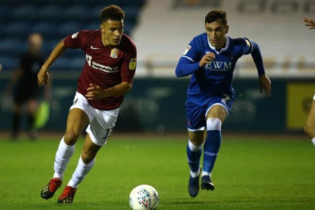 Shaun McWilliams drives forward against Carlisle. Picture: Pete Norton