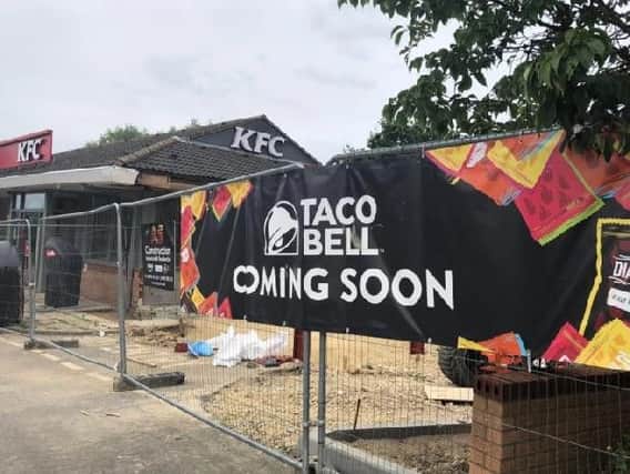 'Coming soon' signs were put up on the fencing surrounding the new Taco Bell site in July.