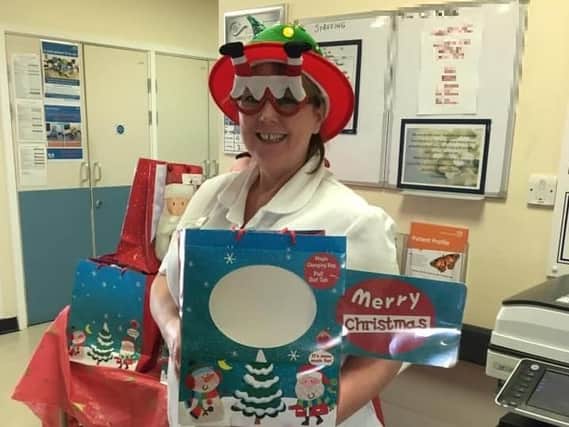 Jane Drew of the Brampton Ward pictured last year spreading some Christmas cheer to NGH wards.