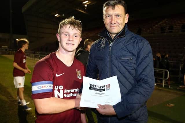 Ian Sampson, the Cobblers academy manager, pictured with Haydn Price, who was named the Under-18s player of the match in their FA Youth Cup defeat to Colchester on Tuesday