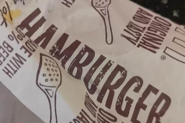 The hamburger wrapper Brook Millar's burger was served in, which turned out to be a cheeseburger