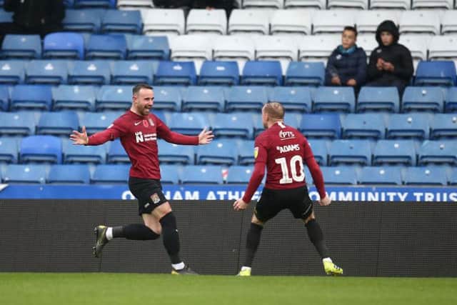 Matty Warburton celebrates his first league goal for the Cobblers. Picture: Pete Norton